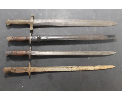 A 1908 WILKINSON BAYONET IN LEATHER SCABBARD, together with a 1907 example (no scabbard), and a relic condition bayonet of si