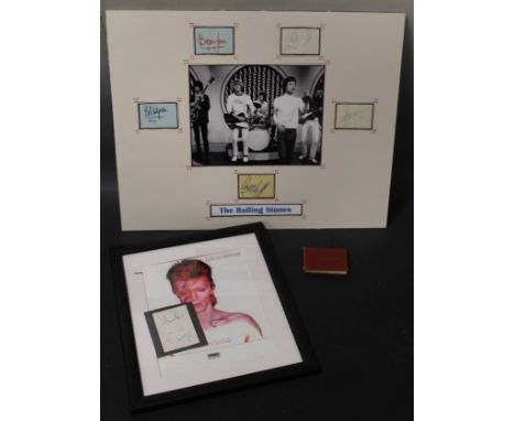 AN AUTOGRAPH ALBUM CONTAINING SIGNATURES FOR THE ROLLING STONES, Mick Jagger, Brian Jones, Bill Wyman, Charlie Watts and Keit