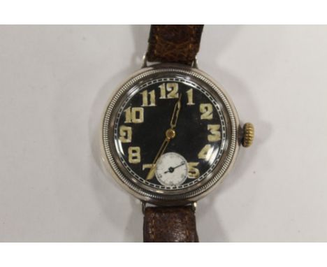 ROLEX, A WWI ERA SILVER CASED TRENCH STYLE WATCH. Black Enamel Dial, with white Sub Dial and Arabic Numerals. Dial un-signed,