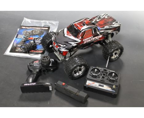 A TRAXXAS 1/16TH SCALE PETROL ENGINE REMOTE CONTROL OFF ROAD VEHICLE 'NITRO STAMPEDE' complete with Traxxas link Wireless Con