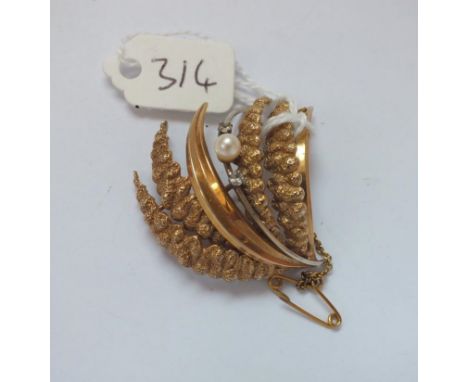 9ct spray brooch set with a pearl and diamonds  8.2g         