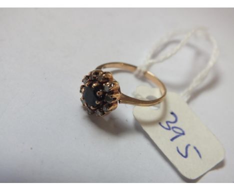 Gold sapphire and diamond cluster ring size E  1.5g.         