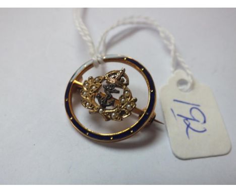 Circular 14ct gold military brooch  set with half pearls and enamel border 3.4g inc   