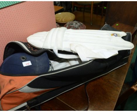 A complete cricket kit; inc. pads, helmet, gloves, box etc