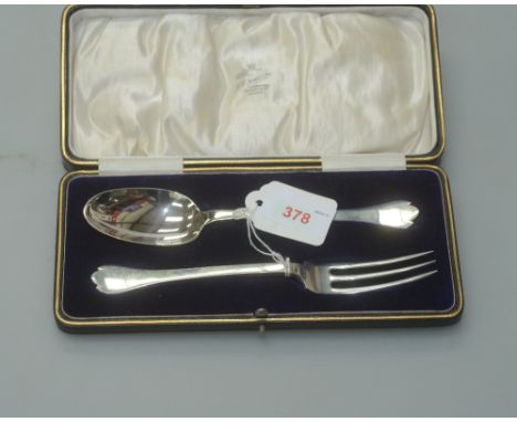 A cased silver spoon and fork, the trefid spoon with rattail, the matching fork with three tines, Sheffield 1920, 3 troy ounc