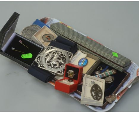 A Queen's Institute of District Nursing belt buckle and badge, a St George & Dragon pierced nurse's belt buckle, a cased ther
