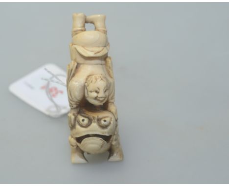A Chinese ivory netsuke of a Liu Hai sporting with the toad (a/f)