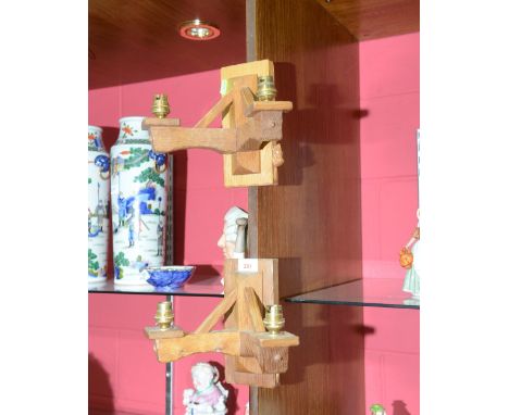 A pair of Colin Beaverman Almack oak twin light wall sconces with carved beaver signature