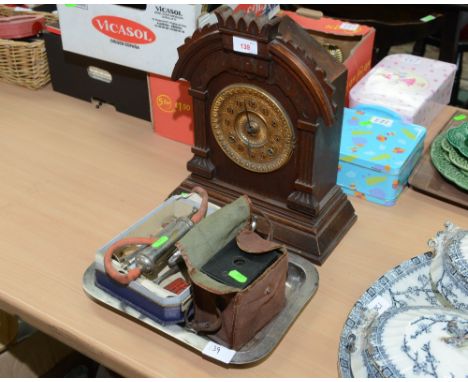 An oak cased mantle clock; tog. with a tray of miscellaneous