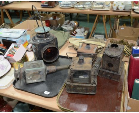 Two trays containing five vintage carriage and railway lamps