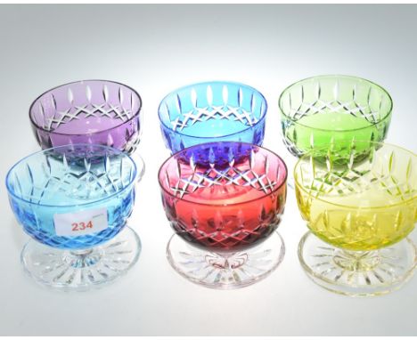 A group of vintage coloured glass grapefruit bowls