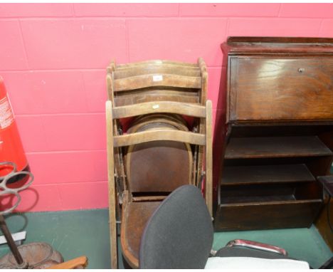A group of five vintage folding chairs