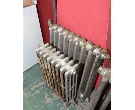 Two small vintage cast iron radiators