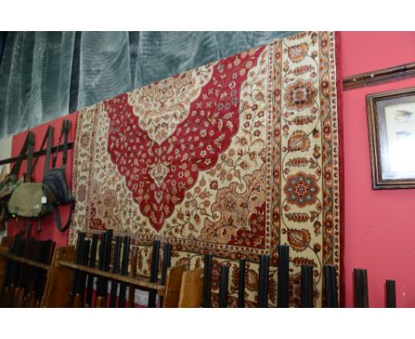 A Kum style carpet with red ground. 2.8m x 2m