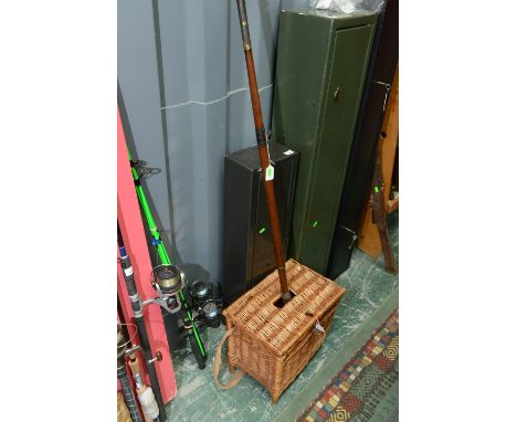 A wicker fishing creel; tog. with a vintage rod