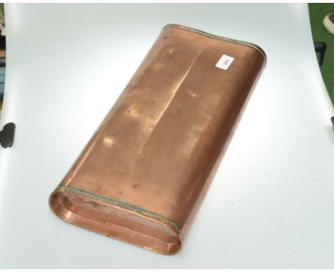 A vintage copper automotive foot warmer
