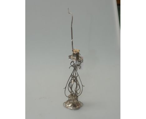A silver candlestick with detachable "go to bed" drip pan, of unusual baluster scrolling wirework design, Birmingham 1994, 6.