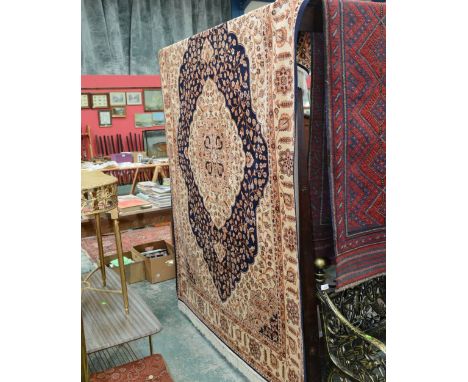 A Kum style carpet with blue ground. 2.3m x 1.6m