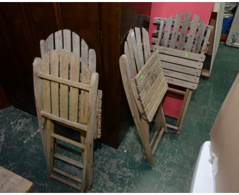 A set of four vintage wooden slatted garden chairs