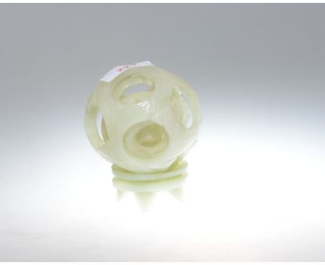 A carved jade ball with four concentric balls on stand (a/f)