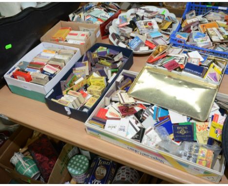 Eight boxes containing a large quantity of matchboxes, playing cards, cigarette boxes etc
