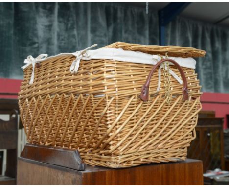 A wicker bombe form wicker hamper
