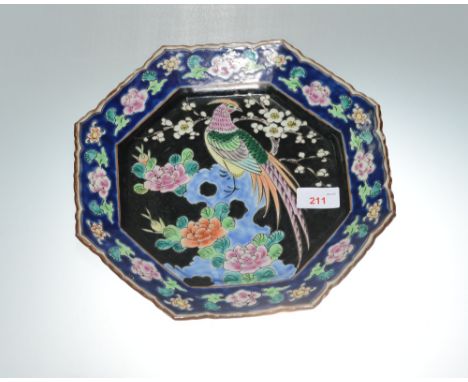 A Chinese enamel octagonal dish decorated with a pheasant amongst prunus