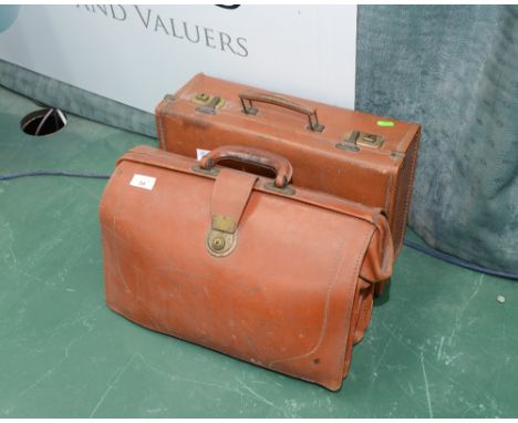A vintage leather briefcase; tog. with a vintage leather suitcase