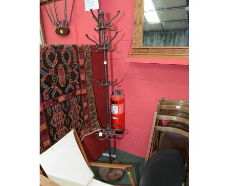 A 19th century cast iron combination stick and coat stand