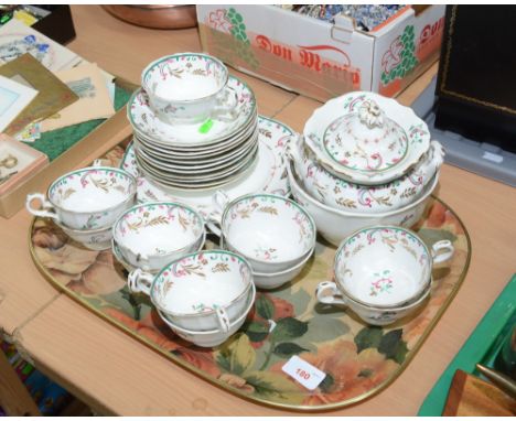 A tray comprising an early 19th century gilt highlighted tea service