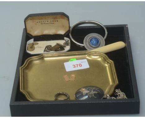 A group comprising silver bangle; gilt cufflinks; Swedish pewter brooch; silver Asian disc pendant; a paste set crescent moon