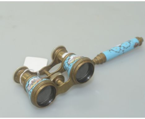 A pair of French enamel opera glasses, with mother of pearl rims to the eye pieces,  the handle and binoculars decorated with