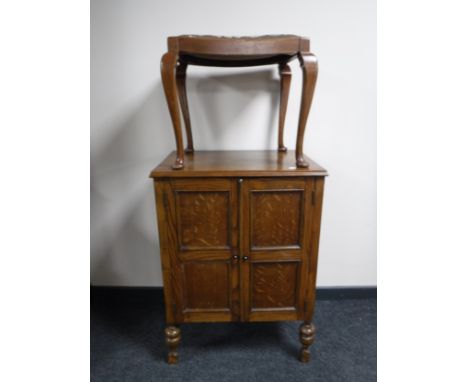 An oak gramophone cabinet together with a tapestry upholstered stool