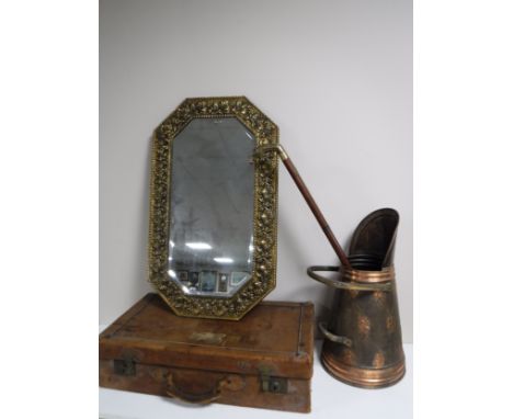 A vintage leather luggage case together with an embossed brass framed mirror, copper coal bucket and brass handled walking st