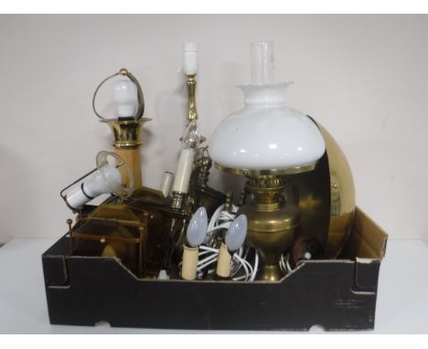 A box of continental brass table lights, wall lights, brass bowl and a brass oil lamp. 