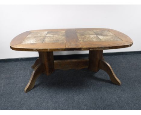 A continental oak tile topped dining table 