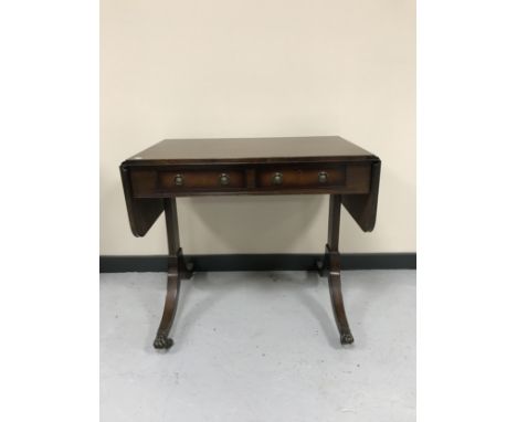 A mahogany sofa table fitted with two drawers 