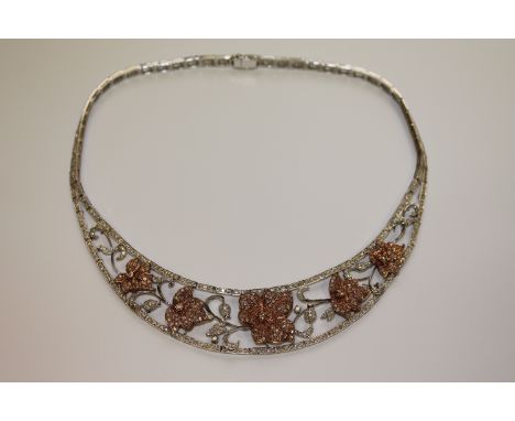 An impressive 18ct white and rose gold diamond set necklace, the total diamond weight estimated at 10ct, 67.6g. CONDITION REP