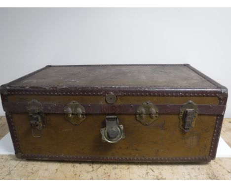 An early twentieth century metal bound travelling trunk