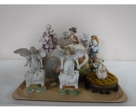 A quantity of continental figures including an Art Nouveau figure, candelabra etc 