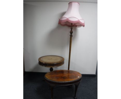 An oak standard lamp with shape together with an oval mahogany coffee table on claw and ball feet together with a drum table