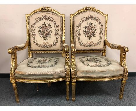 A pair of French gilt armchairs with tapestry upholstered seats