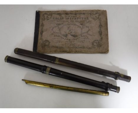 A tin whistle and two part flutes together with a vintage Violin instructor manual 