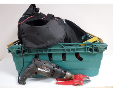 A holdall and crate containing hand tools and power tools