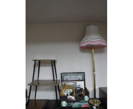 A brass standard lamp with shade together with a nest of two tables and box of framed needlework, gilt porthole mirror, plate