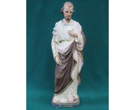 UNGLAZED PAINTED AND GILDED CERAMIC FIGURE DEPICTING ST JOSEPH, APPROXIMATELY 67cm HIGH 