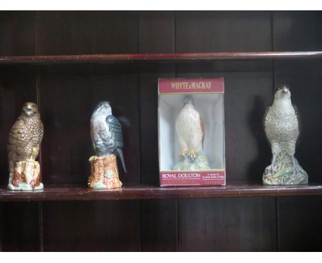 FOUR VARIOUS BESWICK CERAMIC WHISKEY DECANTERS - OSPREY PEREGRINE FALCON, KESTREL AND BUZZARD.