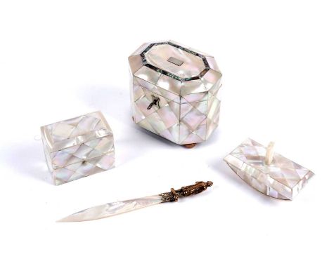 A collection of Victorian and later mother-of-pearl desk accessories, including: a Victorian mother-of-pearl tea caddy, the h