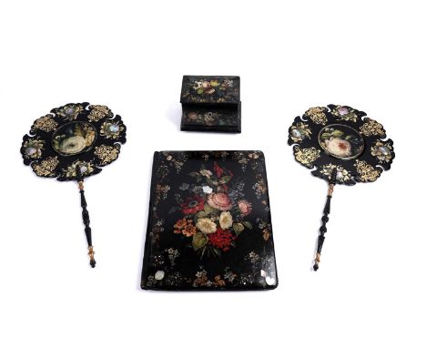 A collection of 19th Century papier-mâché, to include: a tea caddy; a note pad; and a pair of fans, all decorated with gildin