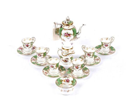A Coalport floral and green batwing pattern coffee service, each with floral decoration within green and gilt batwing borders